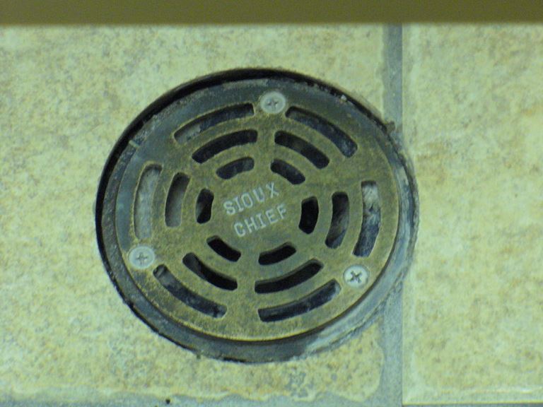 Close-up of Sioux Chief brand floor drain